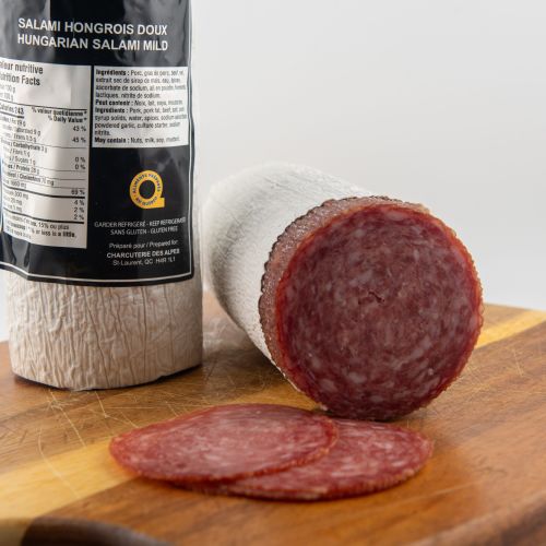 Mild Hungarian salami slices on wooden board